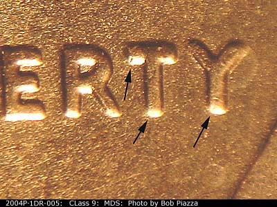 Die-stage B marker on 2004P•1DR•005 (2004 Doubled Die Reverse).
