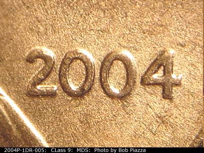 Die-stage B marker on 2004P•1DR•005 (2004 Doubled Die Reverse).