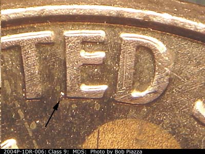 Die-stage B marker on 2004P•1DR•006 (2004 Doubled Die Reverse).