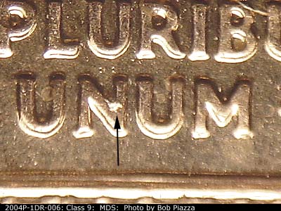Die-stage B marker on 2004P•1DR•006 (2004 Doubled Die Reverse).