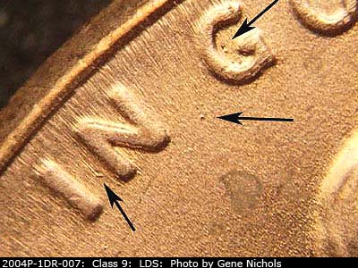 Die-stage B marker on 2004P•1DR•007 (2004 Doubled Die Reverse).