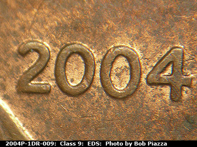 Die-stage A marker on 2004P•1DR•009 (2004 Doubled Die Reverse).