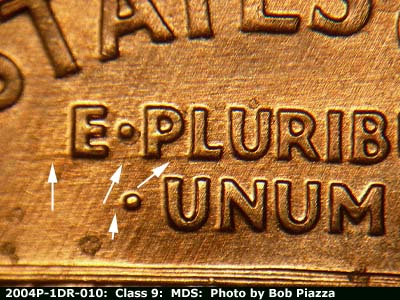 Die-stage B marker on 2004P•1DR•010 (2004 Doubled Die Reverse).