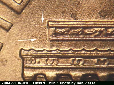 Die-stage B marker on 2004P•1DR•010 (2004 Doubled Die Reverse).