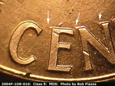 Die-stage B marker on 2004P•1DR•010 (2004 Doubled Die Reverse).