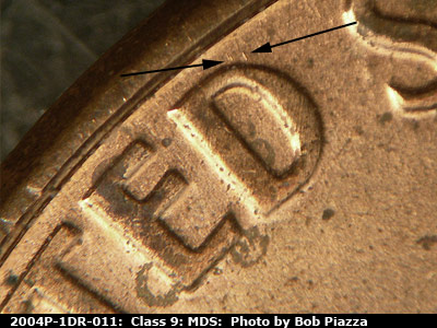 Die-stage B marker on 2004P•1DR•011 (2004 Doubled Die Reverse).