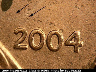 Die-stage B marker on 2004P•1DR•011 (2004 Doubled Die Reverse).