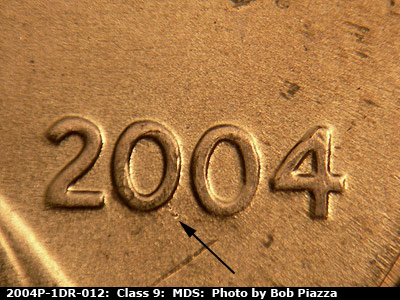 Die-stage B marker on 2004P•1DR•012 (2004 Doubled Die Reverse).