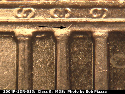 Die-stage B marker on 2004P•1DR•013 (2004 Doubled Die Reverse).