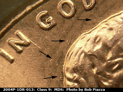 Die-stage B marker on 2004P•1DR•013 (2004 Doubled Die Reverse).