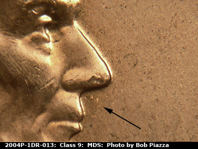Die-stage B marker on 2004P•1DR•013 (2004 Doubled Die Reverse).