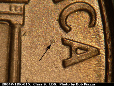 Die-stage C marker on 2004P•1DR•015 (2004 Doubled Die Reverse).