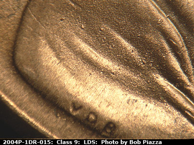 Die-stage C marker on 2004P•1DR•015 (2004 Doubled Die Reverse).