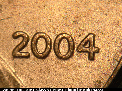 Die-stage B marker on 2004P•1DR•016 (2004 Doubled Die Reverse).