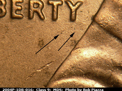 Die-stage B marker on 2004P•1DR•016 (2004 Doubled Die Reverse).