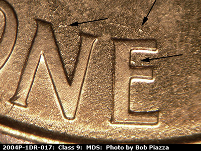 Die-stage B marker on 2004P•1DR•017 (2004 Doubled Die Reverse).