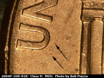 Die-stage B marker on 2004P•1DR•018 (2004 Doubled Die Reverse).