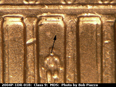 Die-stage B marker on 2004P•1DR•018 (2004 Doubled Die Reverse).