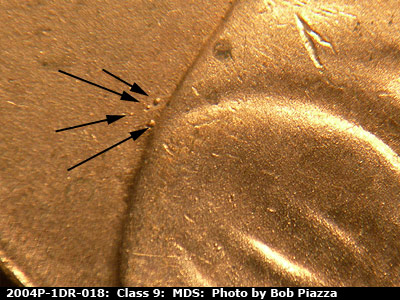 Die-stage B marker on 2004P•1DR•018 (2004 Doubled Die Reverse).