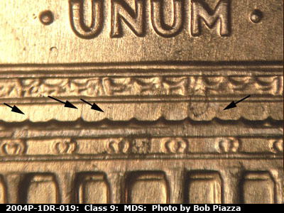 Die-stage B marker on 2004P•1DR•019 (2004 Doubled Die Reverse).