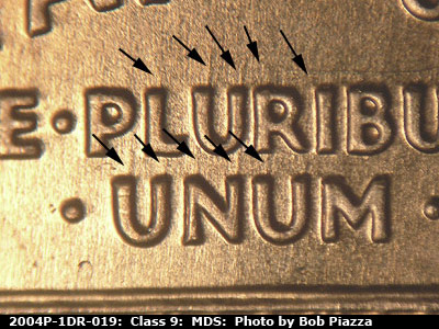 Die-stage B marker on 2004P•1DR•019 (2004 Doubled Die Reverse).