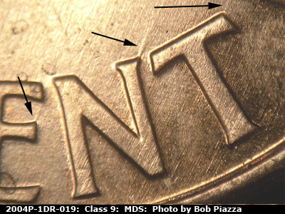 Die-stage B marker on 2004P•1DR•019 (2004 Doubled Die Reverse).