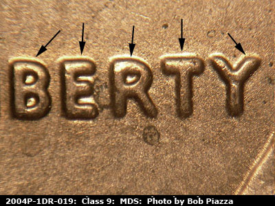 Die-stage B marker on 2004P•1DR•019 (2004 Doubled Die Reverse).