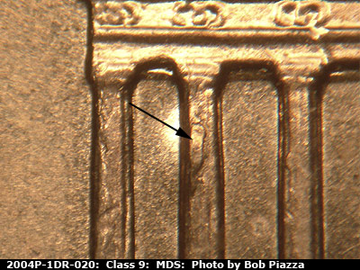 Die-stage B marker on 2004P•1DR•020 (2004 Doubled Die Reverse).