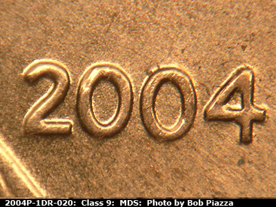 Die-stage B marker on 2004P•1DR•020 (2004 Doubled Die Reverse).