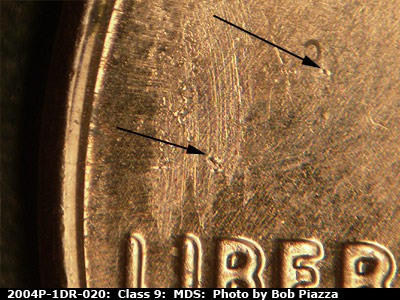 Die-stage B marker on 2004P•1DR•020 (2004 Doubled Die Reverse).