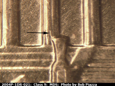 Die-stage B marker on 2004P•1DR•021 (2004 Doubled Die Reverse).