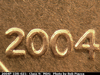 Die-stage B marker on 2004P•1DR•021 (2004 Doubled Die Reverse).