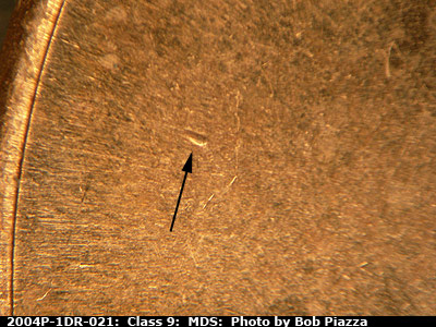 Die-stage B marker on 2004P•1DR•021 (2004 Doubled Die Reverse).