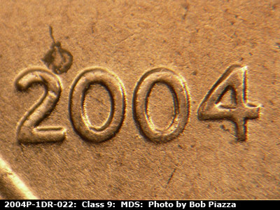 Die-stage B marker on 2004P•1DR•022 (2004 Doubled Die Reverse).