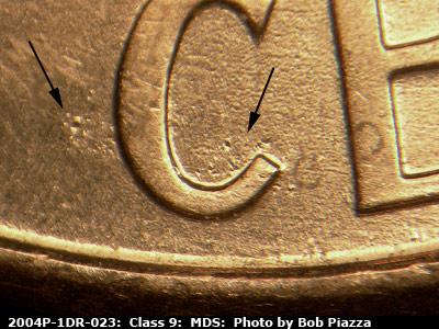 Die-stage B marker on 2004P•1DR•023 (2004 Doubled Die Reverse).