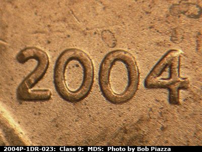Die-stage B marker on 2004P•1DR•023 (2004 Doubled Die Reverse).