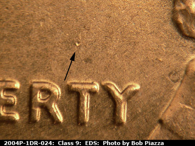 Die-stage A marker on 2004P•1DR•024 (2004 Doubled Die Reverse).