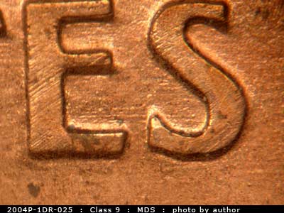 Die-stage B marker on 2004P•1DR•025 (2004 Doubled Die Reverse).