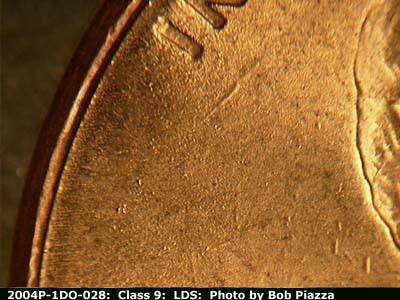 Die-stage C marker on 2004P•1DR•028 (2004 Doubled Die Reverse).