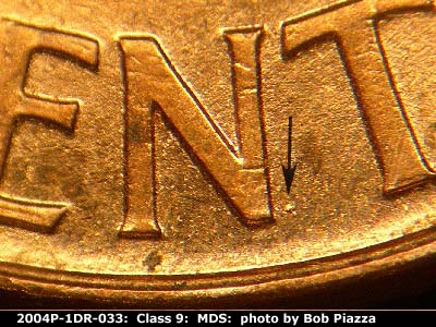 Die-stage B marker on 2004P•1DR•033 (2004 Doubled Die Reverse).