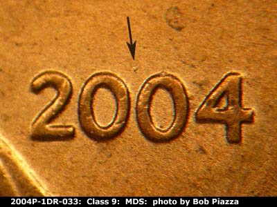 Die-stage B marker on 2004P•1DR•033 (2004 Doubled Die Reverse).