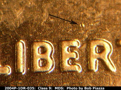 Die-stage B marker on 2004P•1DR•035 (2004 Doubled Die Reverse).