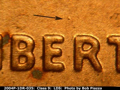 Die-stage C marker on 2004P•1DR•035 (2004 Doubled Die Reverse).