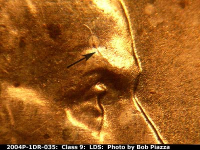 Die-stage C marker on 2004P•1DR•035 (2004 Doubled Die Reverse).