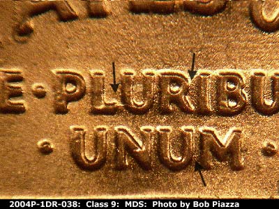 Die-stage B marker on 2004P•1DR•038 (2004 Doubled Die Reverse).