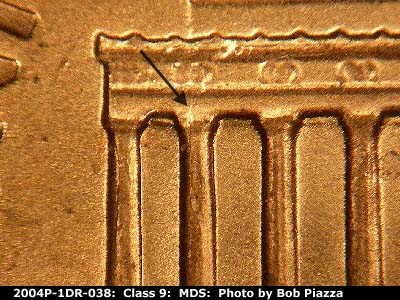Die-stage B marker on 2004P•1DR•038 (2004 Doubled Die Reverse).