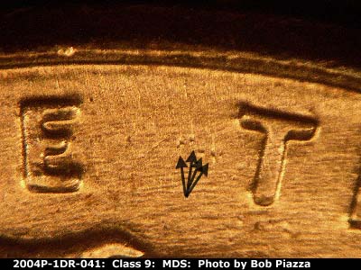 Die-stage B marker on 2004P•1DR•041 (2004 Doubled Die Reverse).