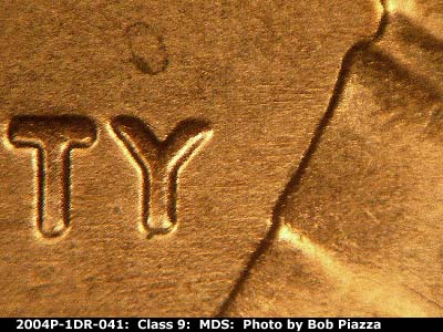 Die-stage B marker on 2004P•1DR•041 (2004 Doubled Die Reverse).