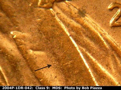 Die-stage B marker on 2004P•1DR•042 (2004 Doubled Die Reverse).