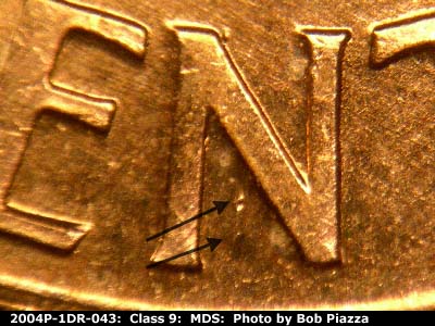 Die-stage B marker on 2004P•1DR•043 (2004 Doubled Die Reverse).